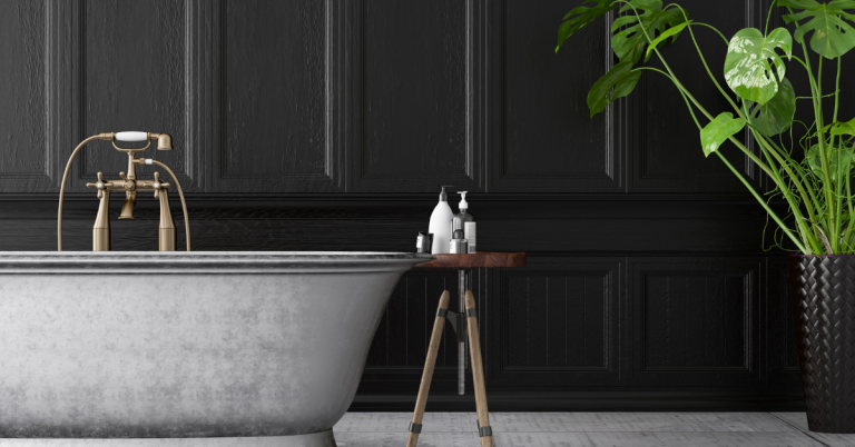 Unique metal bathtub in front of dark paneled walls in Vienna bathroom remodel.