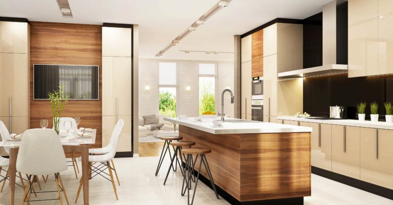 Modern kitchen and dining area with wood cabinetry, island countertop, and contemporary furnishings