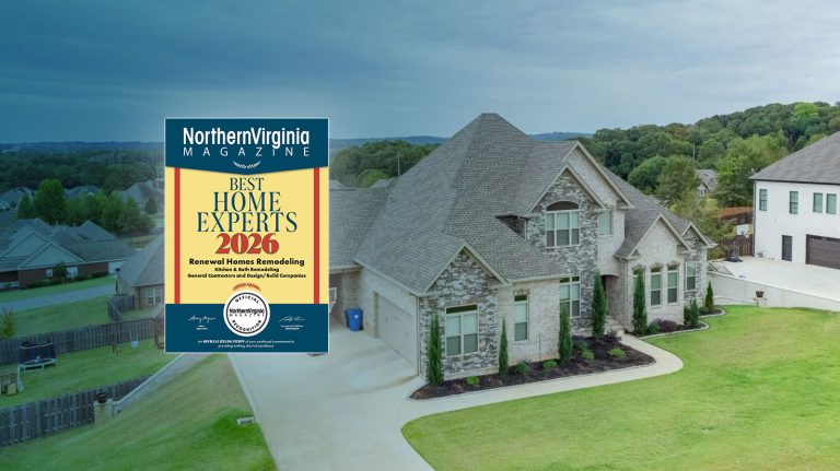 Northampton homes award sign displayed in front of a large gray and white two-story suburban house with manicured lawn
