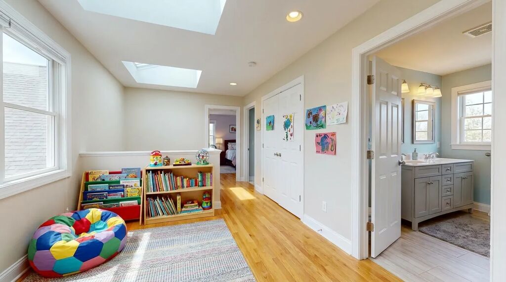 Second-story kids' bedroom wing with shared bathroom and play area